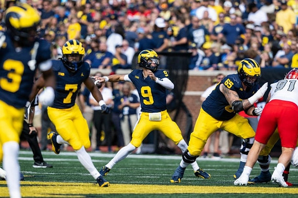 Fredrick Moore (3), Donovan Edwards (7), J.J. McCarthy (9), and Zak Zinter (65)