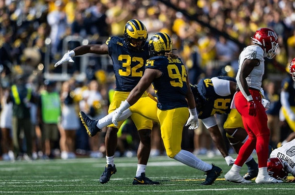 Jaylen Harrell (32), Kris Jenkins (94), and Kenneth Grant (78)