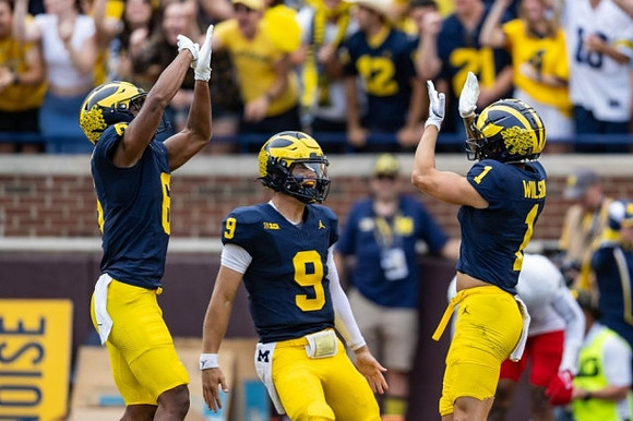 Cornelius Johnson (6), J.J. McCarthy (9), and Roman Wilson (1)