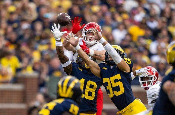 Ernest Hausmann (15), Ja'Den McBurrows (18), and Caden Kolesar (35)