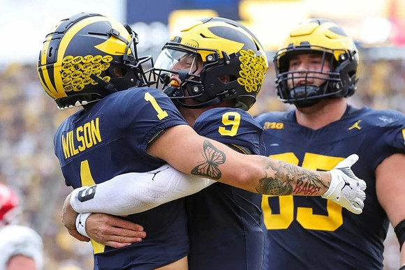 Roman Wilson (1), J.J. McCarthy (9), and Zak Zinter (65)