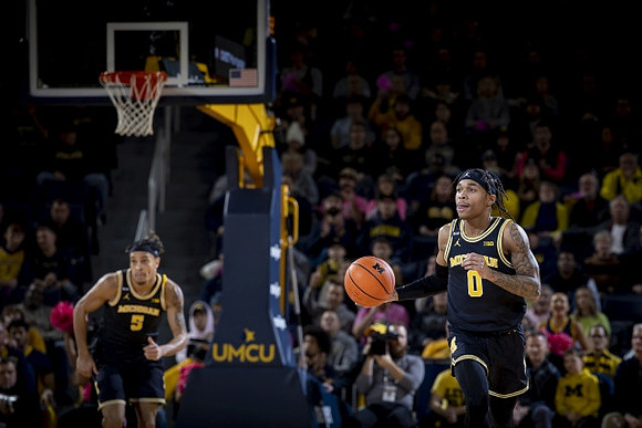 Terrance Williams II (5) and Dug McDaniel (0)