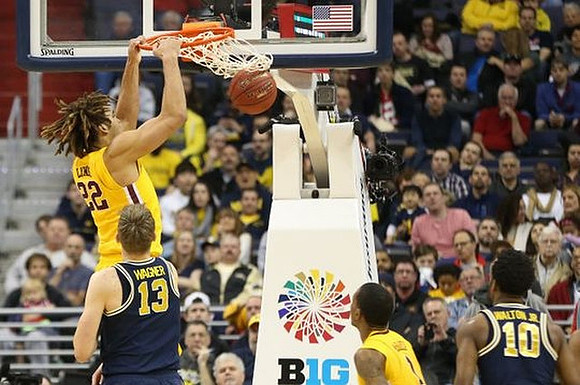 Moritz Wagner (13) and Derrick Walton Jr. (10)