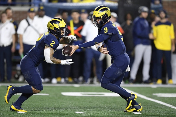Blake Corum (2) and J.J. McCarthy (9)