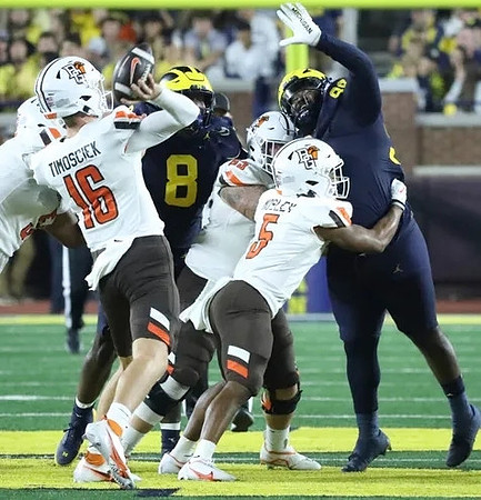 Derrick Moore (8) and Cam Goode (99)