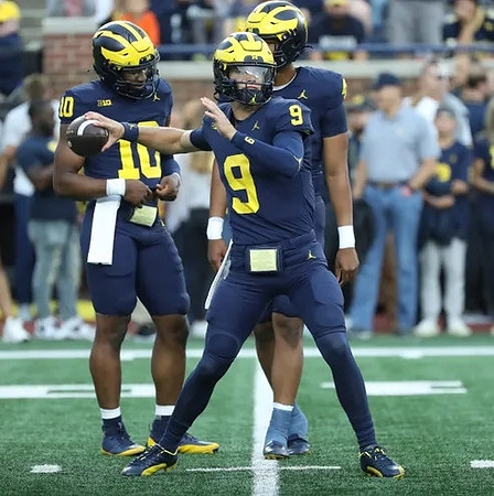 Alex Orji (10), J.J. McCarthy (9), and Jayden Denegal (4)