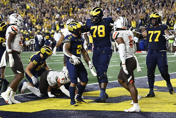 Matthew Hibner (88), Blake Corum (2), Myles Hinton (78), and Trevor Keegan (77)
