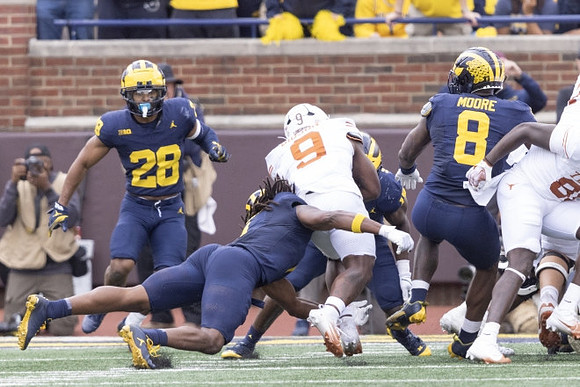 Quinten Johnson (28), Jaishawn Barham (1), and Derrick Moore (8)