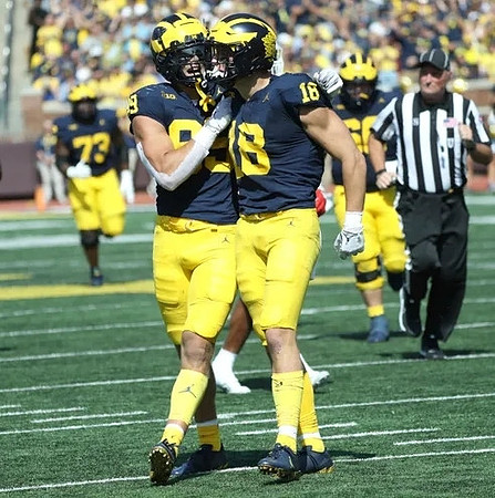 AJ Barner (89) and Colston Loveland (18)