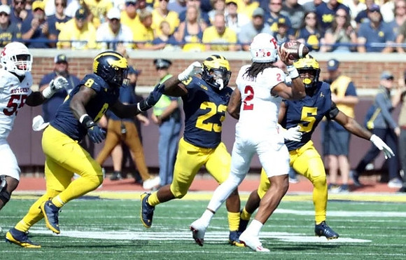 Derrick Moore (8), Michael Barrett (23), and Josaiah Stewart (5)