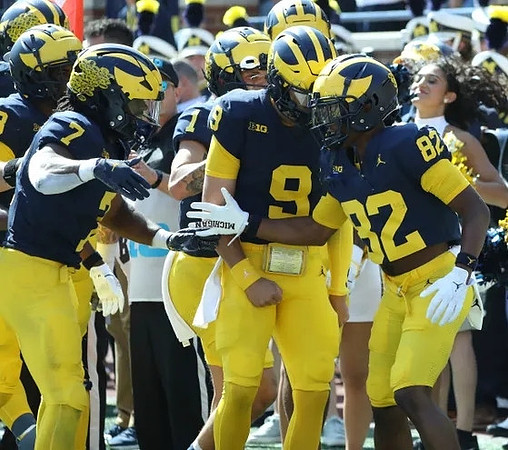 Donovan Edwards (7), J.J. McCarthy (9), Semaj Morgan (82), and Roman Wilson (1)