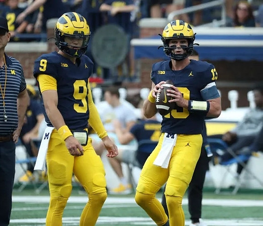 J.J. McCarthy (9) and Jack Tuttle (13)