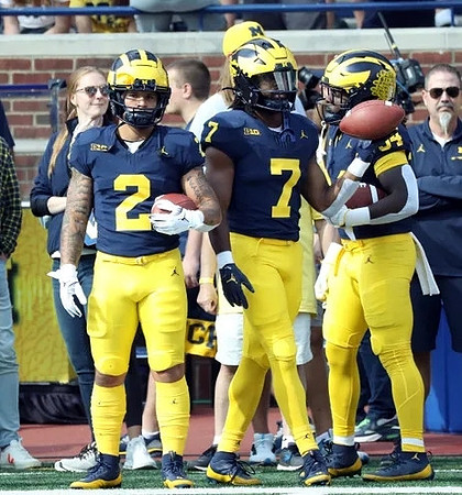 Blake Corum (2) and Donovan Edwards (7)