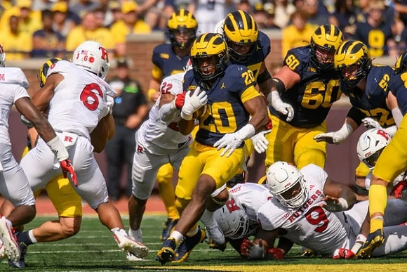 J.J. McCarthy (9), Kalel Mullings (20), Drake Nugent (60), and Karsen Barnhart (52)