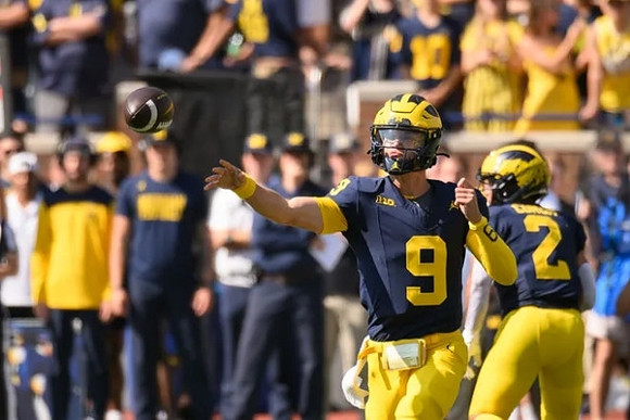 J.J. McCarthy (9) and Blake Corum (2)