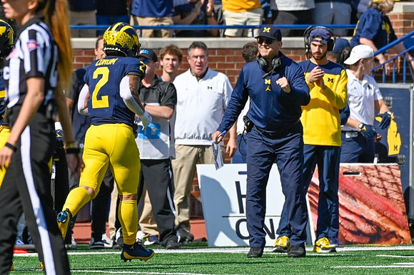 Blake Corum (2) and Jim Harbaugh