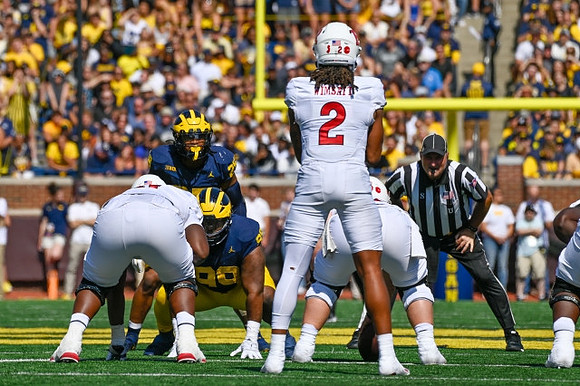 Cam Goode (99) and Junior Colson (25)