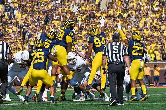 Junior Colson (25), Derrick Moore (8), Kenneth Grant (78), Kris Jenkins (94), and Michael Barrett (23)