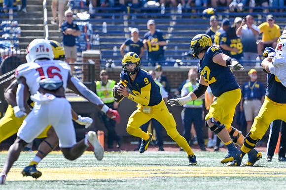 J.J. McCarthy (9) and Karsen Barnhart (52)