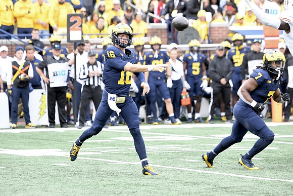 Davis Warren (16) and Donovan Edwards (7)