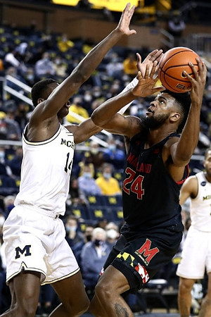 Moussa Diabate (14) and DeVante' Jones (12)