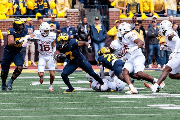 Josh Priebe (68), Donovan Edwards (7), and Kalel Mullings (20)