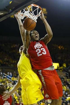 Mitch McGary (4) and Jordan Morgan (52)