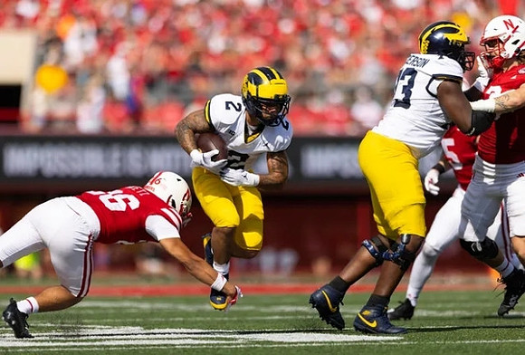 Blake Corum (2) and LaDarius Henderson (73)