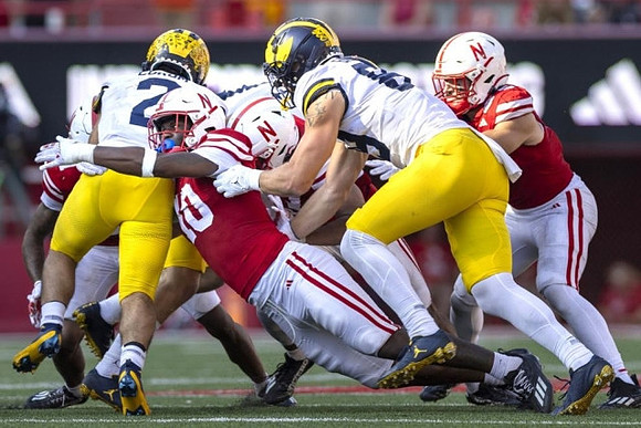 Blake Corum (2) and AJ Barner (89)