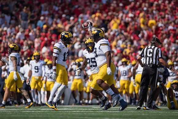 Josh Wallace (12), Junior Colson (25), and Kenneth Grant (78)