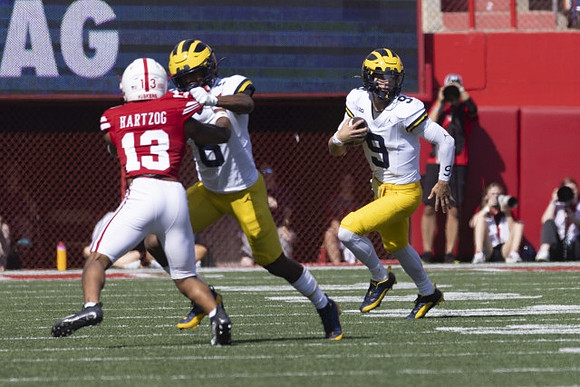 Tyler Morris (8) and J.J. McCarthy (9)