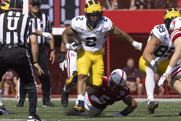 Blake Corum (2) and AJ Barner (89)