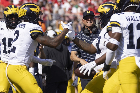 Ernest Hausmann (15), Will Johnson (2), Jim Harbaugh, Kenneth Grant (78), and Josh Wallace (12)