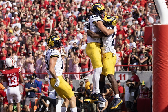 Colston Loveland (18), AJ Barner (89), and Kalel Mullings (20)