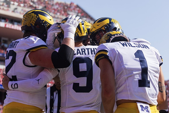 Karsen Barnhart (52), J.J. McCarthy (9), and Roman Wilson (1)