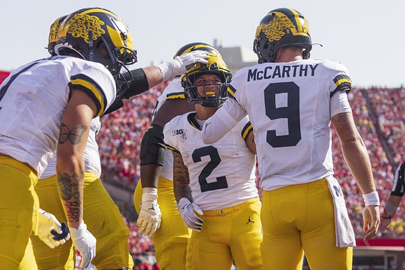 Roman Wilson (1), Blake Corum (2), and J.J. McCarthy (9)