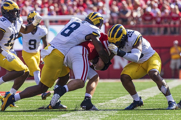 Ernest Hausmann (15), Rod Moore (9), Derrick Moore (8), and Junior Colson (25)