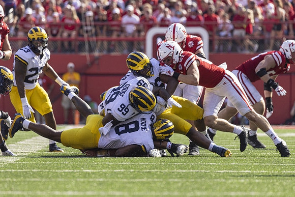 Michael Barrett (23), Derrick Moore (8), Cam Goode (99), and Rayshaun Benny (26)