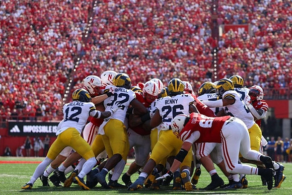 Josh Wallace (12), Jaylen Harrell (32), Rayshaun Benny (26), and Makari Paige (7)
