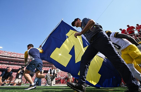 Jim Harbaugh and Mike Sainristil (0)
