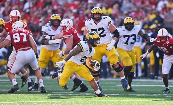 Trevor Keegan (77), Blake Corum (2), Karsen Barnhart (52), and LaDarius Henderson (73)