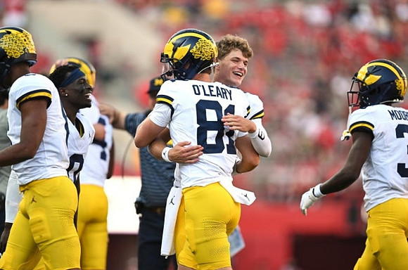 Mike Sainristil (0), J.J. McCarthy (9), Peyton O'Leary (81), and Fredrick Moore (3)
