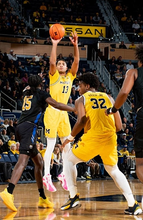 Jett Howard (13) and Tarris Reed Jr. (32)