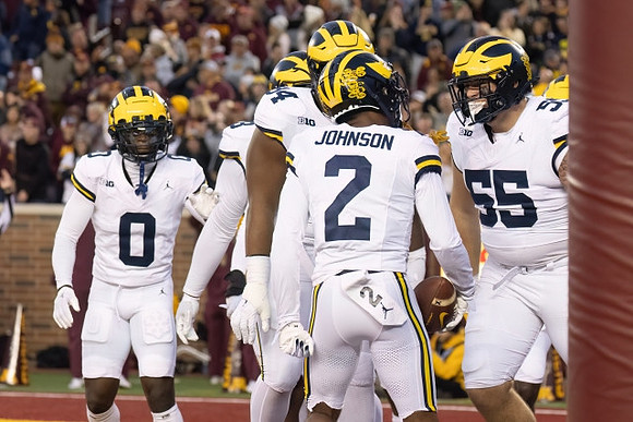Mike Sainristil (0), Kris Jenkins (94), Will Johnson (2), and Mason Graham (55)