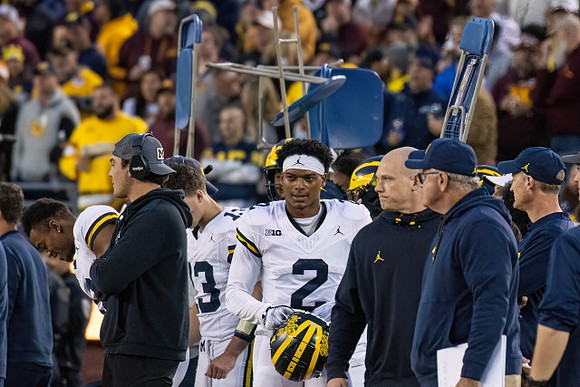 Will Johnson (2) and Michigan Team