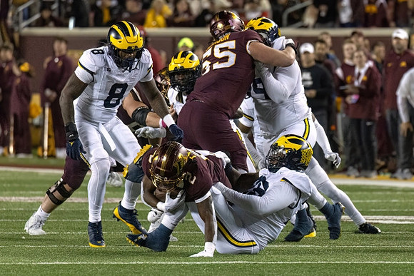 Derrick Moore (8) and Cam Goode (99)