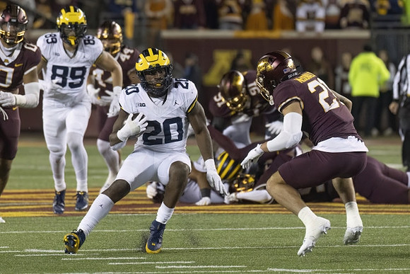 AJ Barner (89) and Kalel Mullings (20)