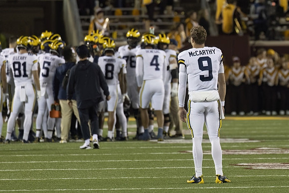 J.J. McCarthy (9) and Michigan Team