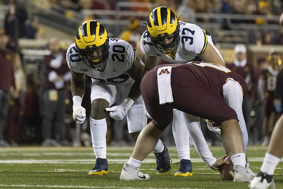 Jyaire Hill (20) and Danny Hughes (37)