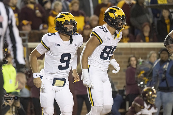 J.J. McCarthy (9) and AJ Barner (89)